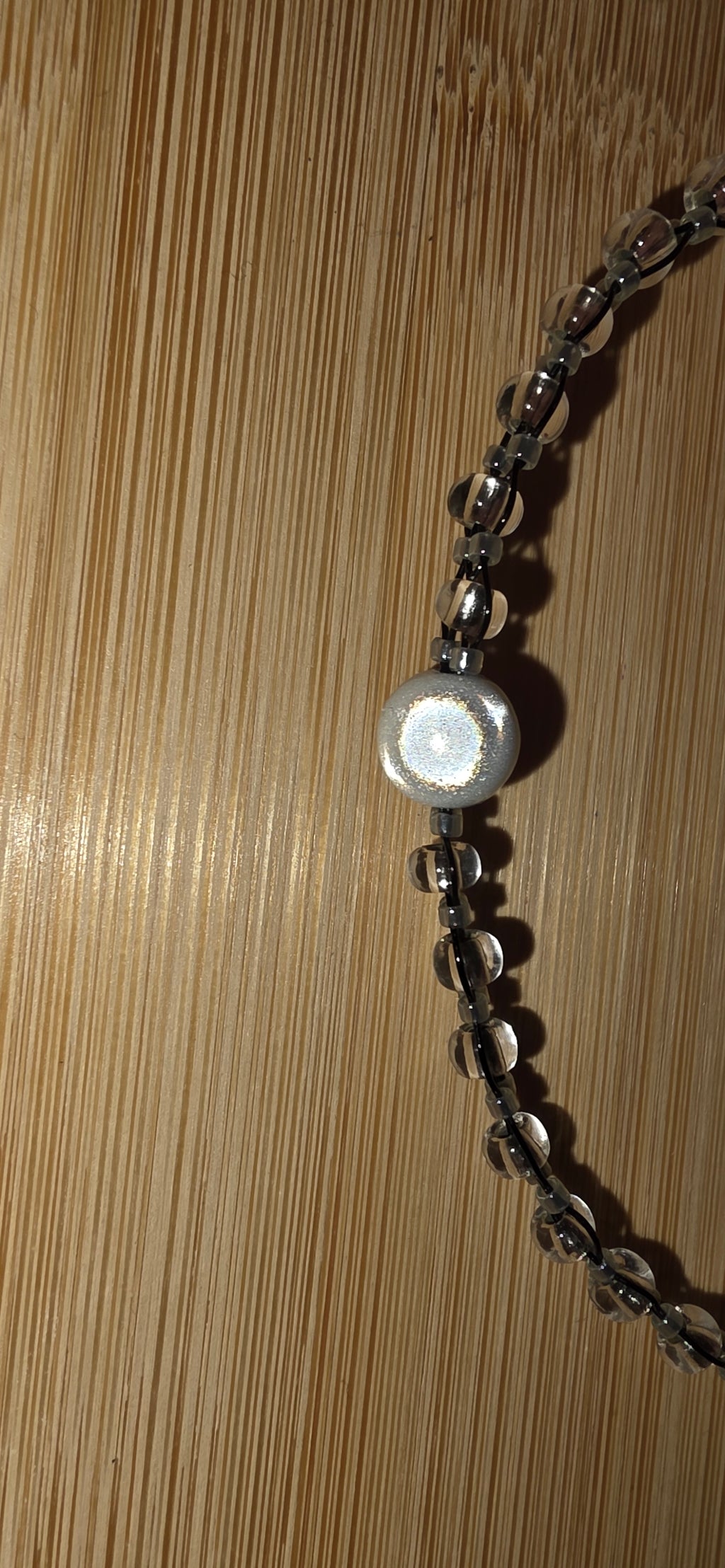 Reflective set of earrings and necklace