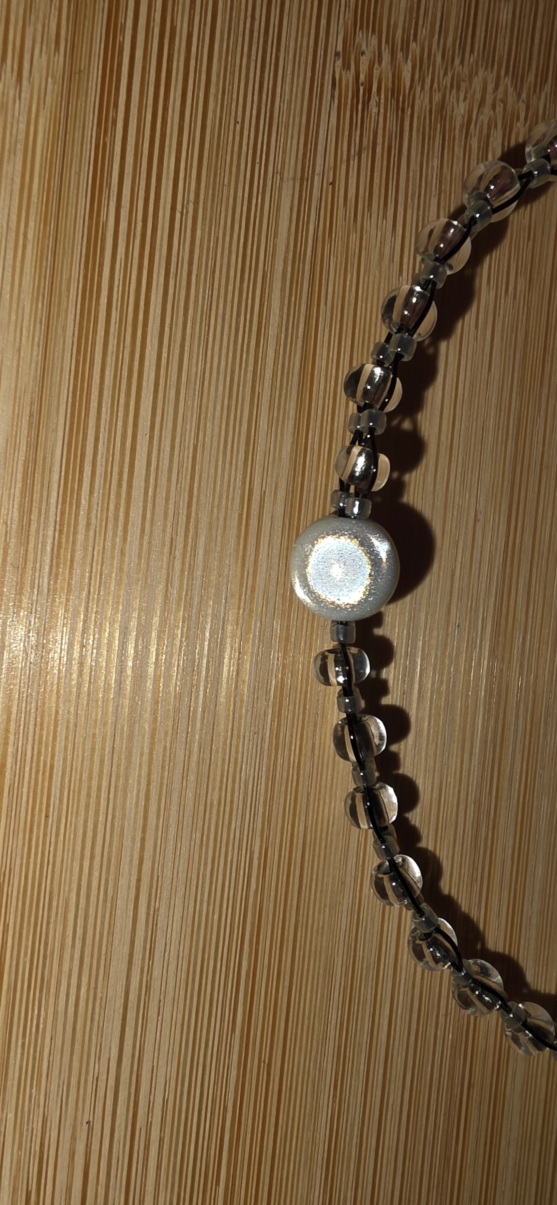 Reflective set of earrings and necklace