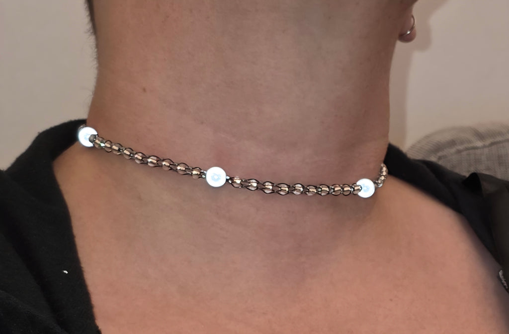 Reflective set of earrings and necklace