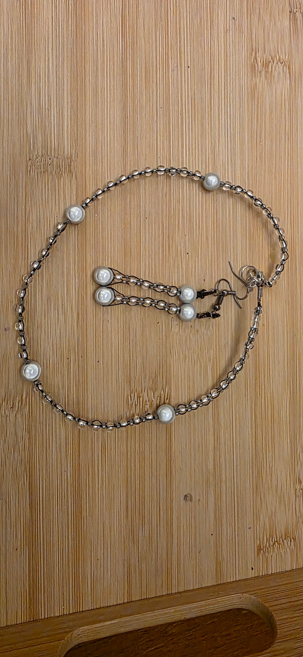 Reflective set of earrings and necklace