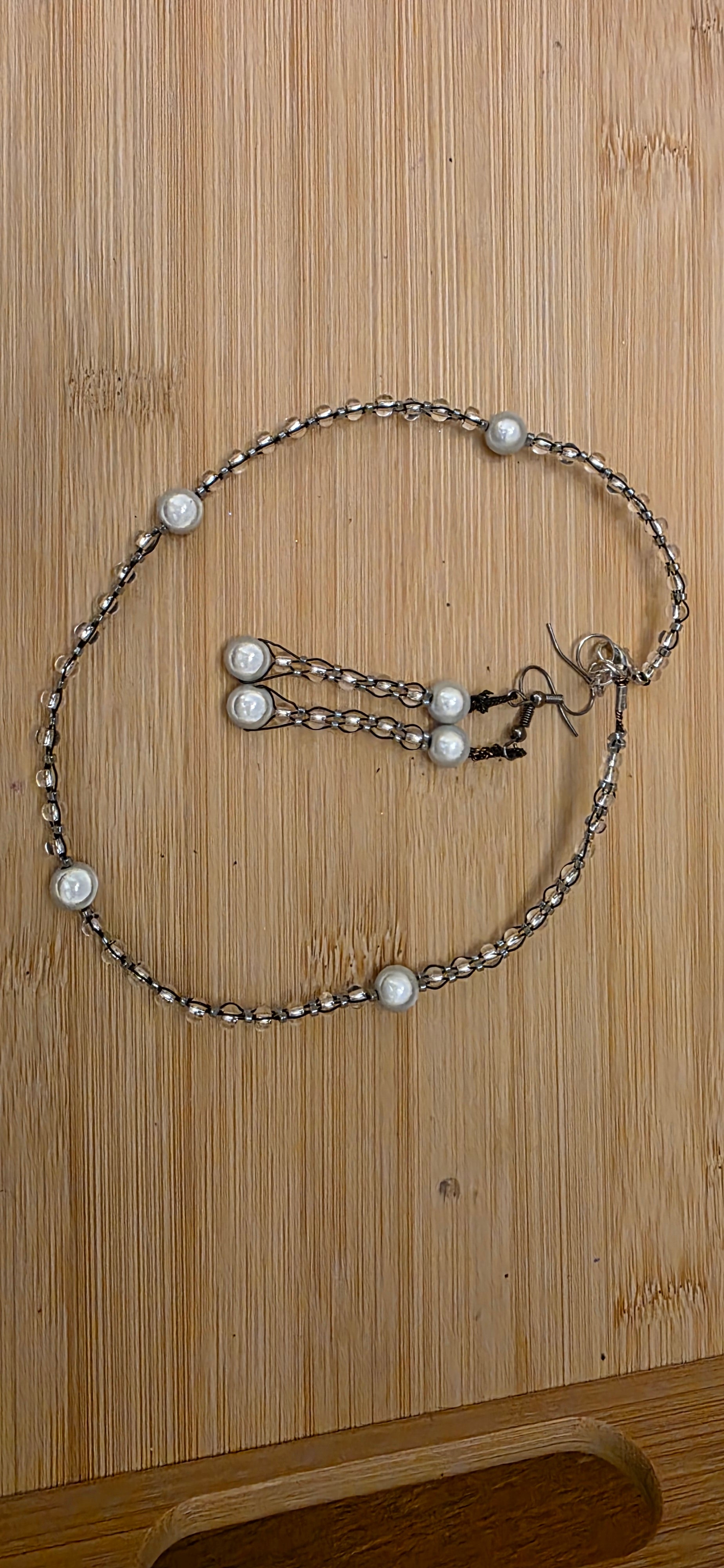 Reflective set of earrings and necklace