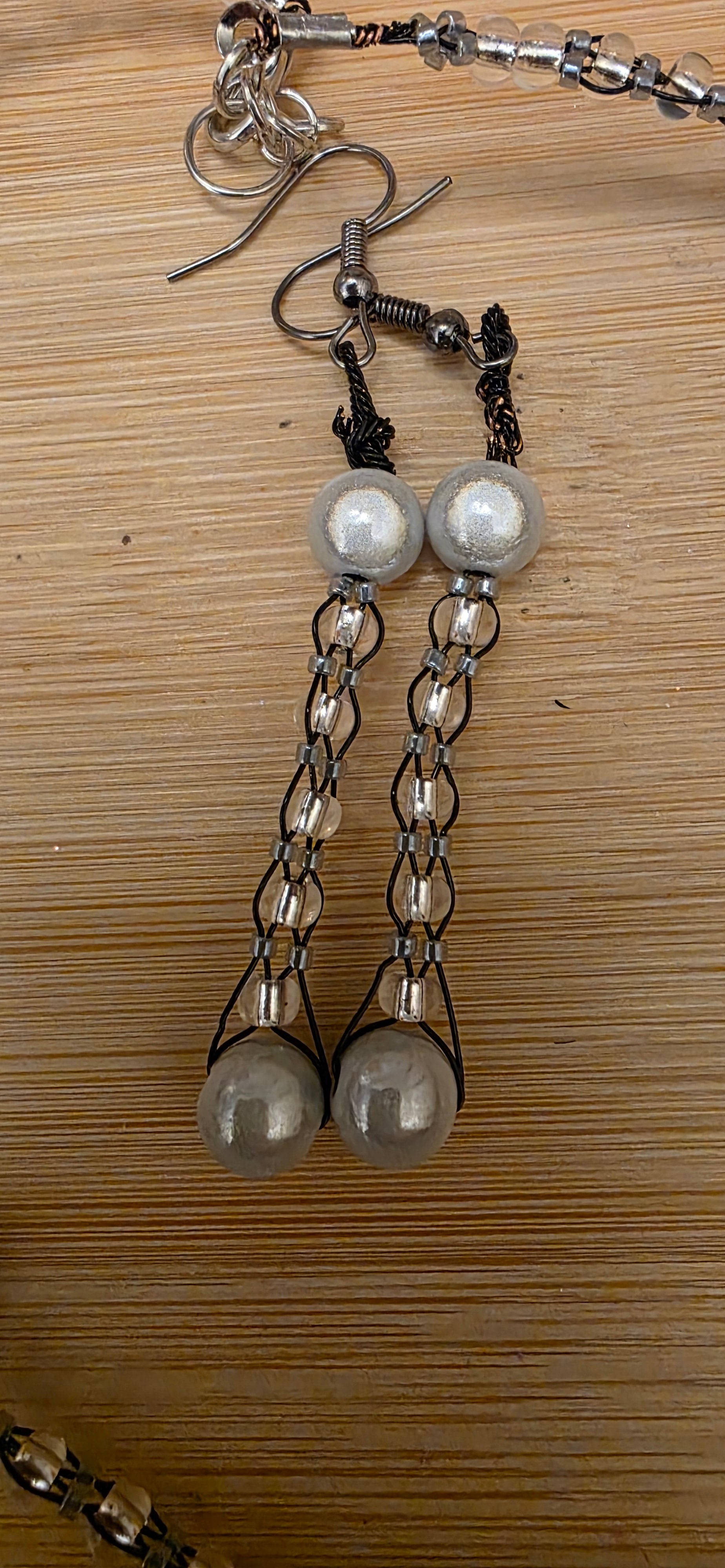 Reflective set of earrings and necklace